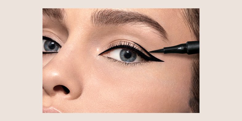 A lady with a winged out eyeliner look